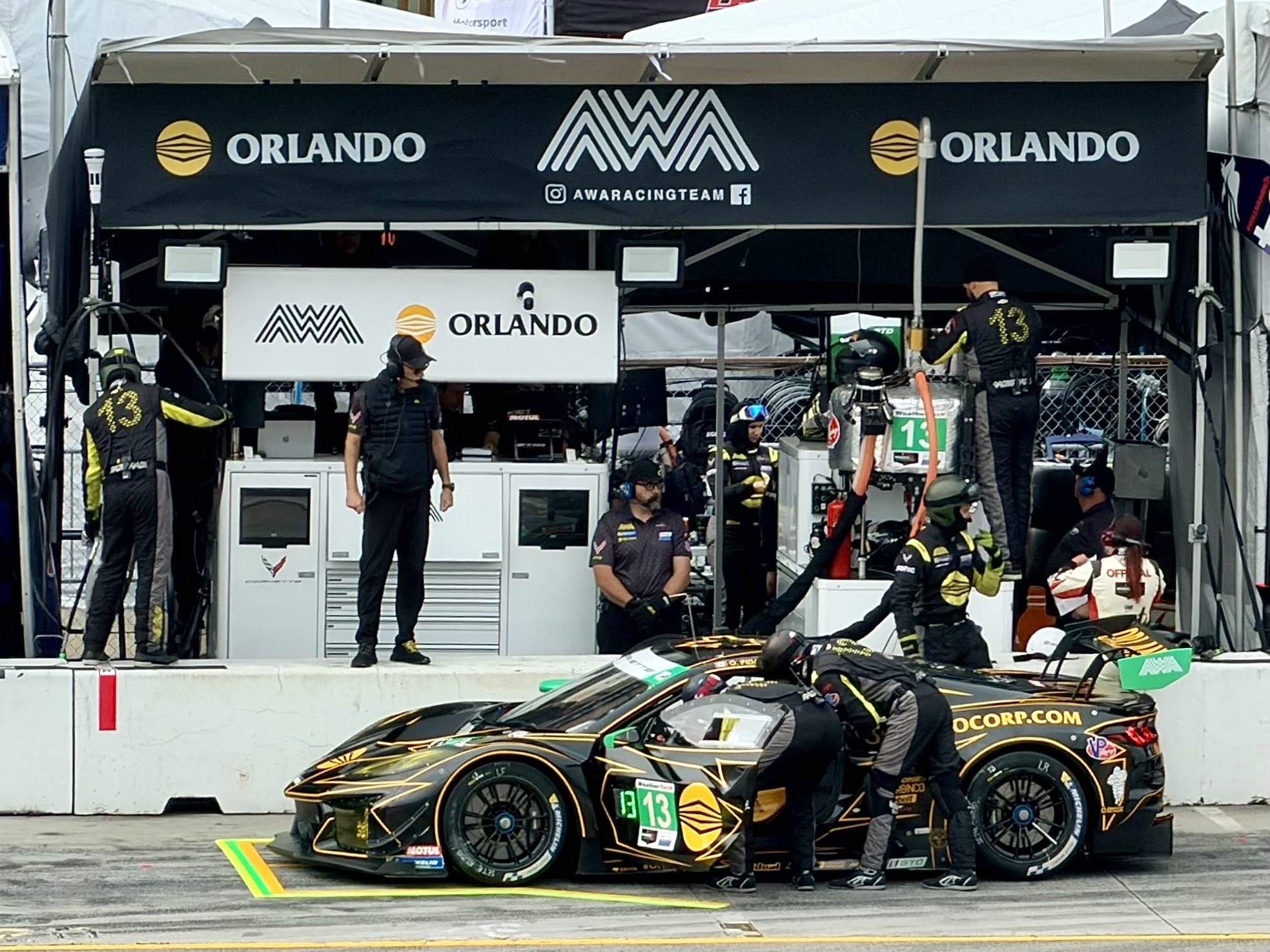 A Corvette GT3 race car parked in its pit box